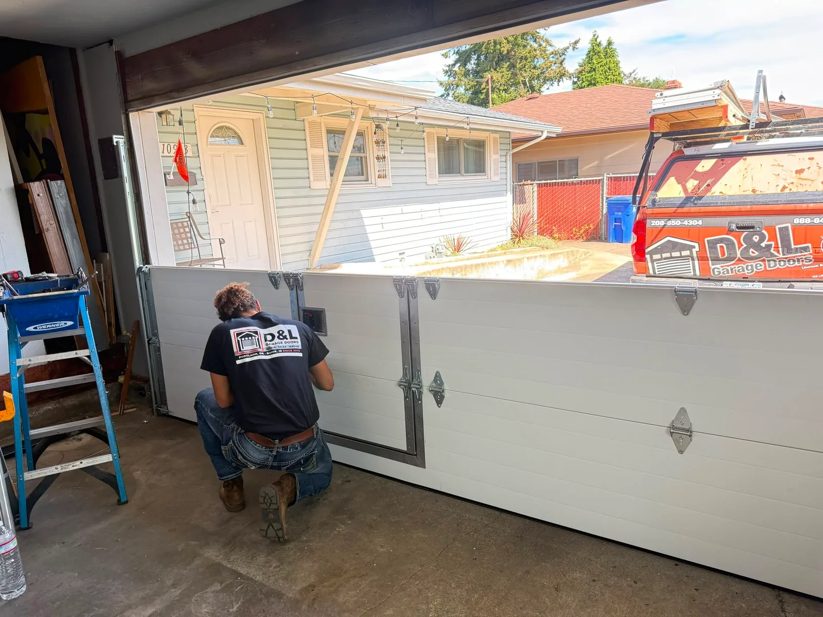 D&L technician assembling the Portland pass-door installation